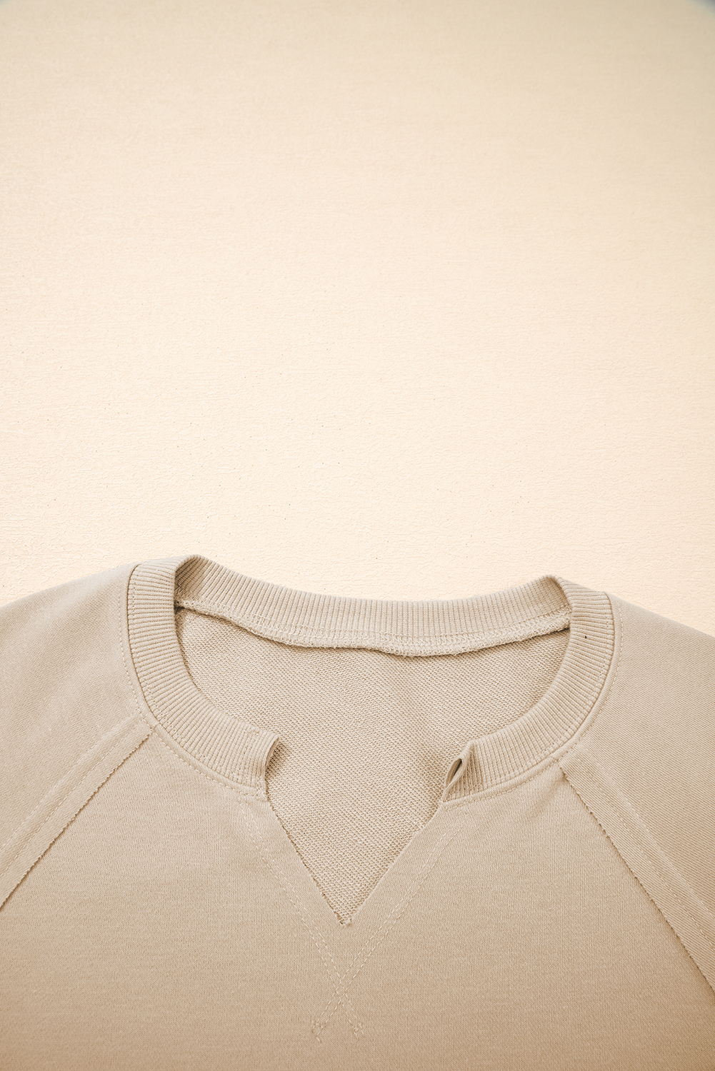 Parchment Raw Edge Exposed Seam Raglan Sleeve Side Slit Sweatshirt